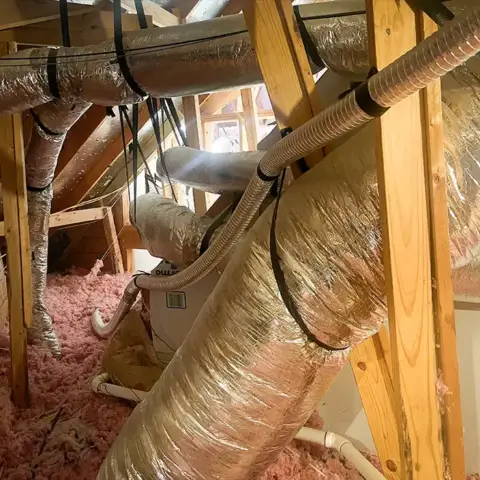 A system of ductwork that was repaired by American Heritage Air.